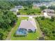 Aerial view of house featuring a screened pool, landscaped yard, and neighborhood at 2511 Stagnaro Rd, North Port, FL 34287