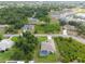 Aerial view of house featuring a screened pool, neighborhood and landscaped yard at 2511 Stagnaro Rd, North Port, FL 34287