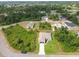 Bird's-eye view of a well-maintained property with a pool, spacious yard, and lush landscaping at 2511 Stagnaro Rd, North Port, FL 34287