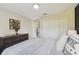 Bedroom showcasing a closet and a dresser, complete with coordinated decor at 2511 Stagnaro Rd, North Port, FL 34287