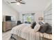 Bedroom with large window letting in natural light, plush pillows and a dresser at 2511 Stagnaro Rd, North Port, FL 34287