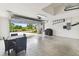 Spacious garage with an open door, featuring ample space for storage and parking at 2511 Stagnaro Rd, North Port, FL 34287