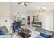 Open-concept living room flows into the dining room and features vaulted ceilings at 2511 Stagnaro Rd, North Port, FL 34287