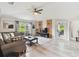 Comfortable living room with modern decor, accent wall, and lots of natural light at 2511 Stagnaro Rd, North Port, FL 34287