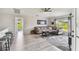 Comfortable living room features neutral tones, stylish decor, and an open layout with views of the outdoors at 2511 Stagnaro Rd, North Port, FL 34287