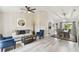 Open-concept living room flows into the dining room with bright, neutral decor at 2511 Stagnaro Rd, North Port, FL 34287