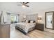 Beautifully decorated main bedroom featuring a large bed, modern furniture, and serene natural light at 2511 Stagnaro Rd, North Port, FL 34287