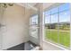 Modern tiled shower with glass door and a large window offering outdoor views at 2511 Stagnaro Rd, North Port, FL 34287