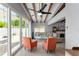 Relaxing living room with coral armchairs and sliding doors to the patio at 2832 Greenbriar St, Sarasota, FL 34237