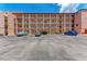 Condo building exterior view showing parking at 4159 Heron Way # E303, Bradenton, FL 34205