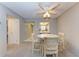 Casual dining area with a round table, four chairs and kitchen pass-through at 4159 Heron Way # E303, Bradenton, FL 34205