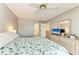 Bedroom with ceiling fan and large closet at 4159 Heron Way # E303, Bradenton, FL 34205
