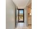 Condo entryway with view into the kitchen at 4159 Heron Way # E303, Bradenton, FL 34205