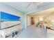 Living room offering an open floor plan and a large TV at 4159 Heron Way # E303, Bradenton, FL 34205