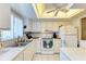 Well-lit kitchen with white cabinets and modern appliances at 4159 Heron Way # E303, Bradenton, FL 34205