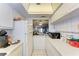 Full kitchen view showcasing ample counter space and a pass-through to dining area at 4159 Heron Way # E303, Bradenton, FL 34205