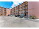 Condo building exterior with parking area at 4159 Heron Way # E303, Bradenton, FL 34205