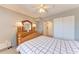 Bright bedroom with a ceiling fan and double closets at 4159 Heron Way # E303, Bradenton, FL 34205
