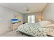 Bedroom with patio access and ceiling fan at 4159 Heron Way # E303, Bradenton, FL 34205