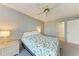 Bedroom with ceiling fan and double closets at 4159 Heron Way # E303, Bradenton, FL 34205