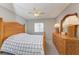 Comfortable bedroom with a wooden bed frame and matching dresser at 4159 Heron Way # E303, Bradenton, FL 34205