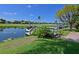 Steps leading down to a private boat dock with boat lift at 10402 Riverbank Ter, Bradenton, FL 34212