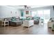 Spacious living room with a sectional sofa and large windows at 655 N Clermont Rd, Venice, FL 34292