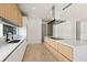 Modern kitchen with island, stainless steel appliances, and light wood cabinets at 1734 Wisconsin Ln, Sarasota, FL 34239