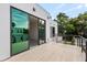Private balcony with tiled flooring and metal railing offering scenic views at 1734 Wisconsin Ln, Sarasota, FL 34239