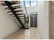 Modern floating staircase with glass railings at 1734 Wisconsin Ln, Sarasota, FL 34239