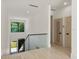 Modern staircase with glass railing overlooking the entryway at 1734 Wisconsin Ln, Sarasota, FL 34239