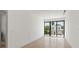 Bright bedroom with large sliding glass doors leading to a balcony at 1734 Wisconsin Ln, Sarasota, FL 34239