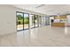 Bright living area with open concept design and kitchen access at 1734 Wisconsin Ln, Sarasota, FL 34239