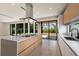 Modern kitchen with island, stainless steel appliances, and access to backyard at 1734 Wisconsin Ln, Sarasota, FL 34239