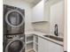 Laundry room with washer, dryer, and utility sink at 1734 Wisconsin Ln, Sarasota, FL 34239