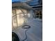 Exterior shot of pool area with enclosed toilet and outdoor shower for convenience at 15 Tee View Pl, Rotonda West, FL 33947
