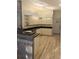 Bright kitchen with white cabinets, dark countertops, and a breakfast bar, seamlessly connecting to other living areas at 15 Tee View Pl, Rotonda West, FL 33947