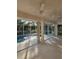Relaxing screened-in outdoor pool area with ceiling fans provides the perfect oasis at 15 Tee View Pl, Rotonda West, FL 33947