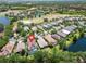 Birds eye view of a neighborhood next to a golf course and body of water at 7249 Orchid Island Pl, Bradenton, FL 34202