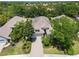 Stunning aerial view of a home with a well-manicured lawn and lush landscaping at 7249 Orchid Island Pl, Bradenton, FL 34202
