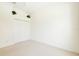 This is a bright bedroom with white walls, carpeted floors, and a closet with louvered doors at 7249 Orchid Island Pl, Bradenton, FL 34202