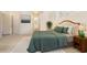 Bedroom with a comfortable bed, a bathroom view, and a bright, inviting atmosphere at 7249 Orchid Island Pl, Bradenton, FL 34202