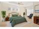 Cozy bedroom with a comfortable bed and sitting area, creating a relaxing retreat at 7249 Orchid Island Pl, Bradenton, FL 34202
