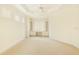 Unfurnished bedroom with bright neutral walls and carpet featuring a desk and built in shelves at 7249 Orchid Island Pl, Bradenton, FL 34202