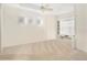 Bright and airy bedroom with neutral colors, featuring a built-in desk area at 7249 Orchid Island Pl, Bradenton, FL 34202