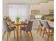 Bright breakfast nook featuring a round table and chairs set, next to white kitchen with counter seating at 7249 Orchid Island Pl, Bradenton, FL 34202