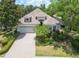 Beautiful single-story home with lush landscaping and a brick-paved driveway at 7249 Orchid Island Pl, Bradenton, FL 34202