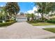 Charming single Gathering home with a brick paved driveway, two-car garage, and well manicured landscaping at 7249 Orchid Island Pl, Bradenton, FL 34202