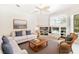 Inviting living room with a white sofa and built-in shelving, offering a relaxing space at 7249 Orchid Island Pl, Bradenton, FL 34202