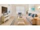Inviting living room featuring comfortable seating and tasteful decor with views to the kitchen at 7249 Orchid Island Pl, Bradenton, FL 34202